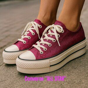 Converse Chuck Taylor All Star Lift Platform Glitter sneakers.